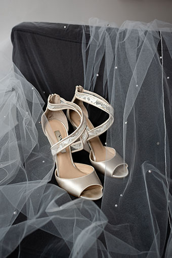 Close up detail of bride veil and shoes